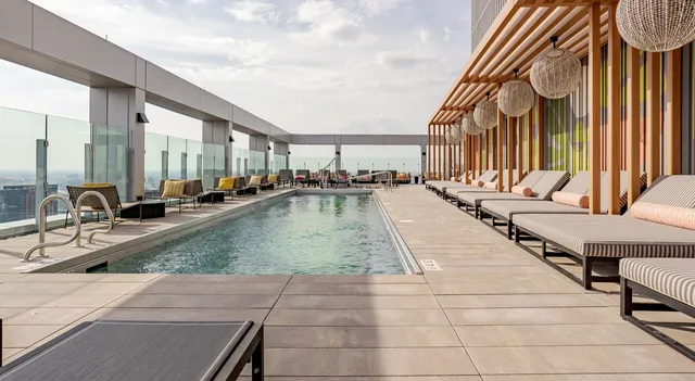 a view of a swimming pool with chairs