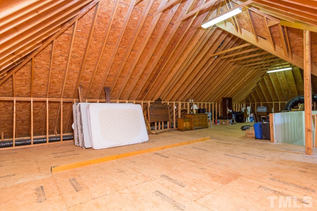 7220 Sunset Glen Point Raleigh, NC 27614 - Photo 23 of 25 The walk-up attic is an absolute marvel! You won't believe how much you can store in it.