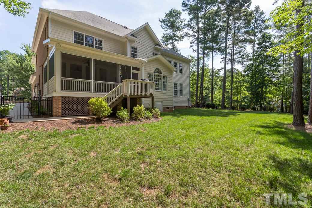 7220 Sunset Glen Point Raleigh, NC 27614 - Photo 24 of 25 The fenced yard is wonderfully kept and the flower beds are ready for your favorite flowers!