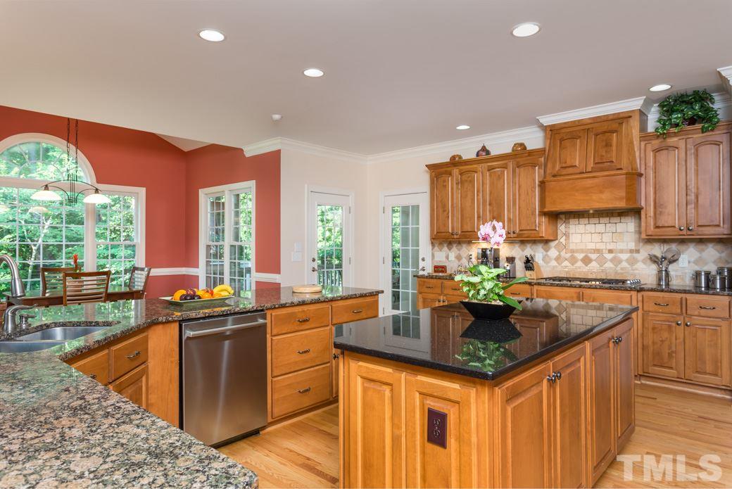 7220 Sunset Glen Point Raleigh, NC 27614 - Photo 5 of 25 Extra long eat-in bar can accommodate quite an audience!