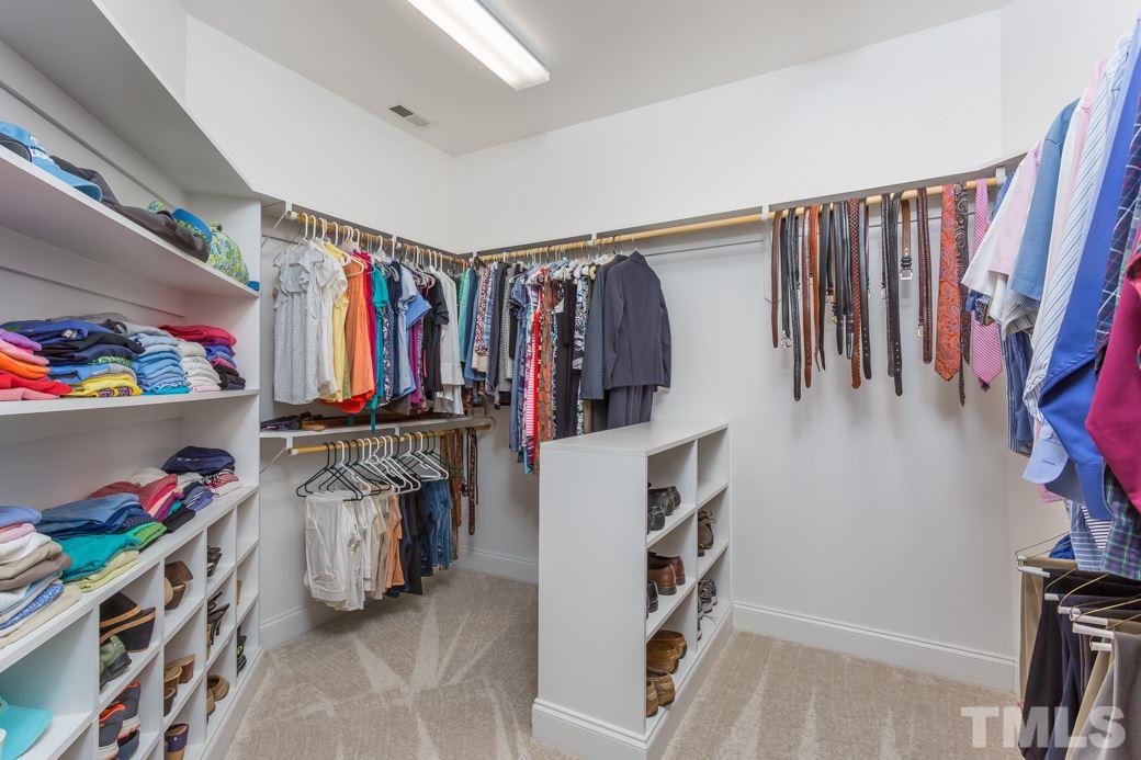 7220 Sunset Glen Point Raleigh, NC 27614 - Photo 9 of 25 Look at this amazing closet! Clever built-ins and bars maximize the space for your wardrobe.