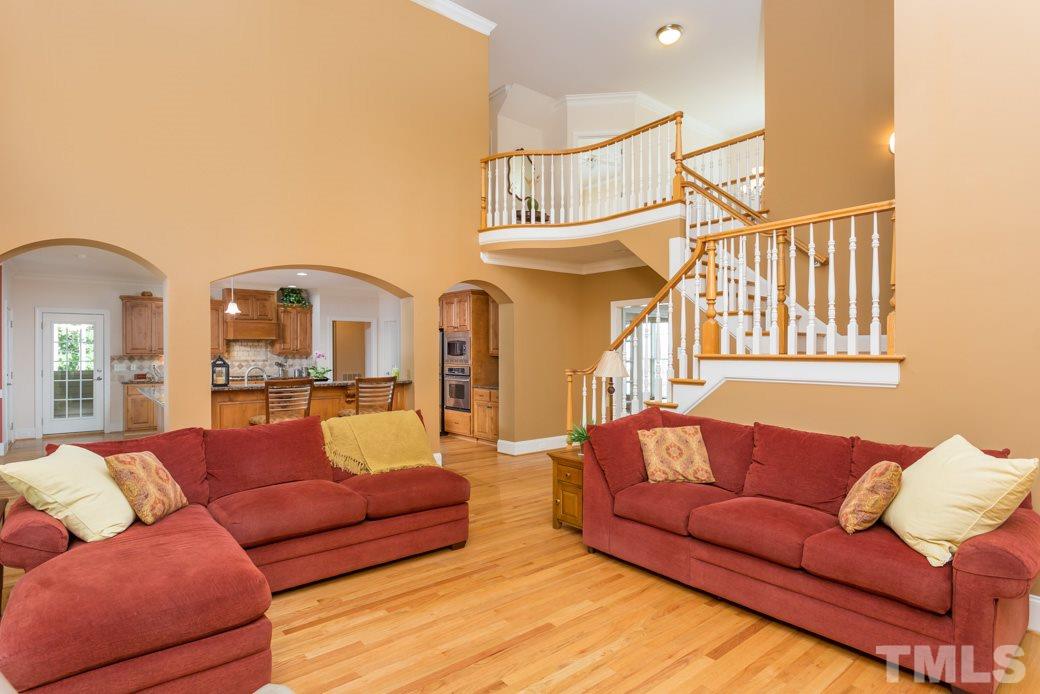 7220 Sunset Glen Point Raleigh, NC 27614 - Photo 10 of 25 Entertaining is easy between the open kitchen, family room and XL screened porch.