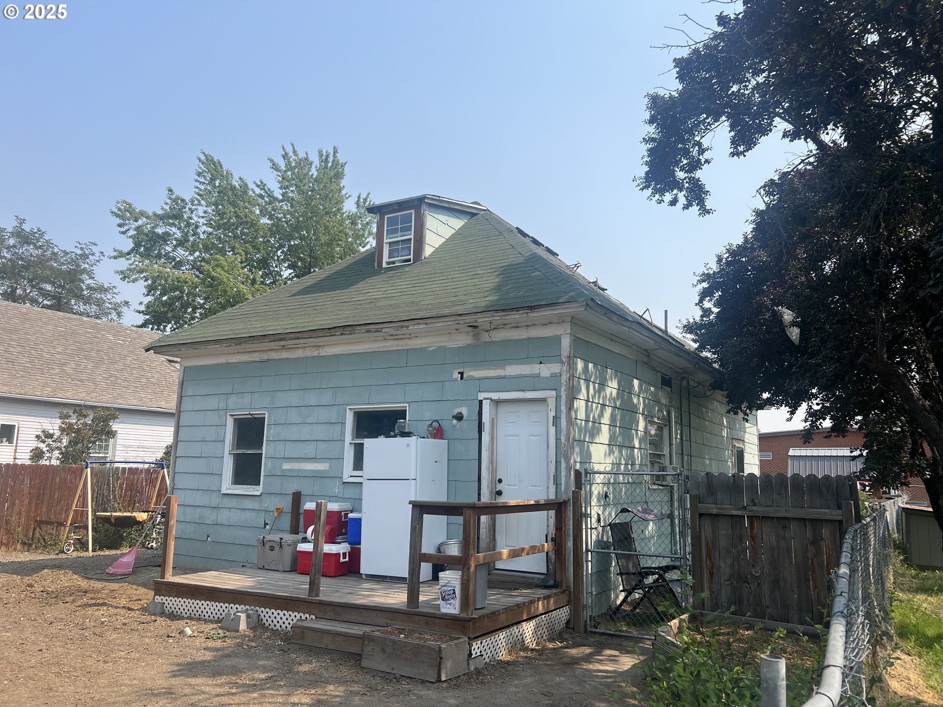 1235 4th Street Baker City, OR 97814 - Photo 4 of 6 a front view of a house with a garage