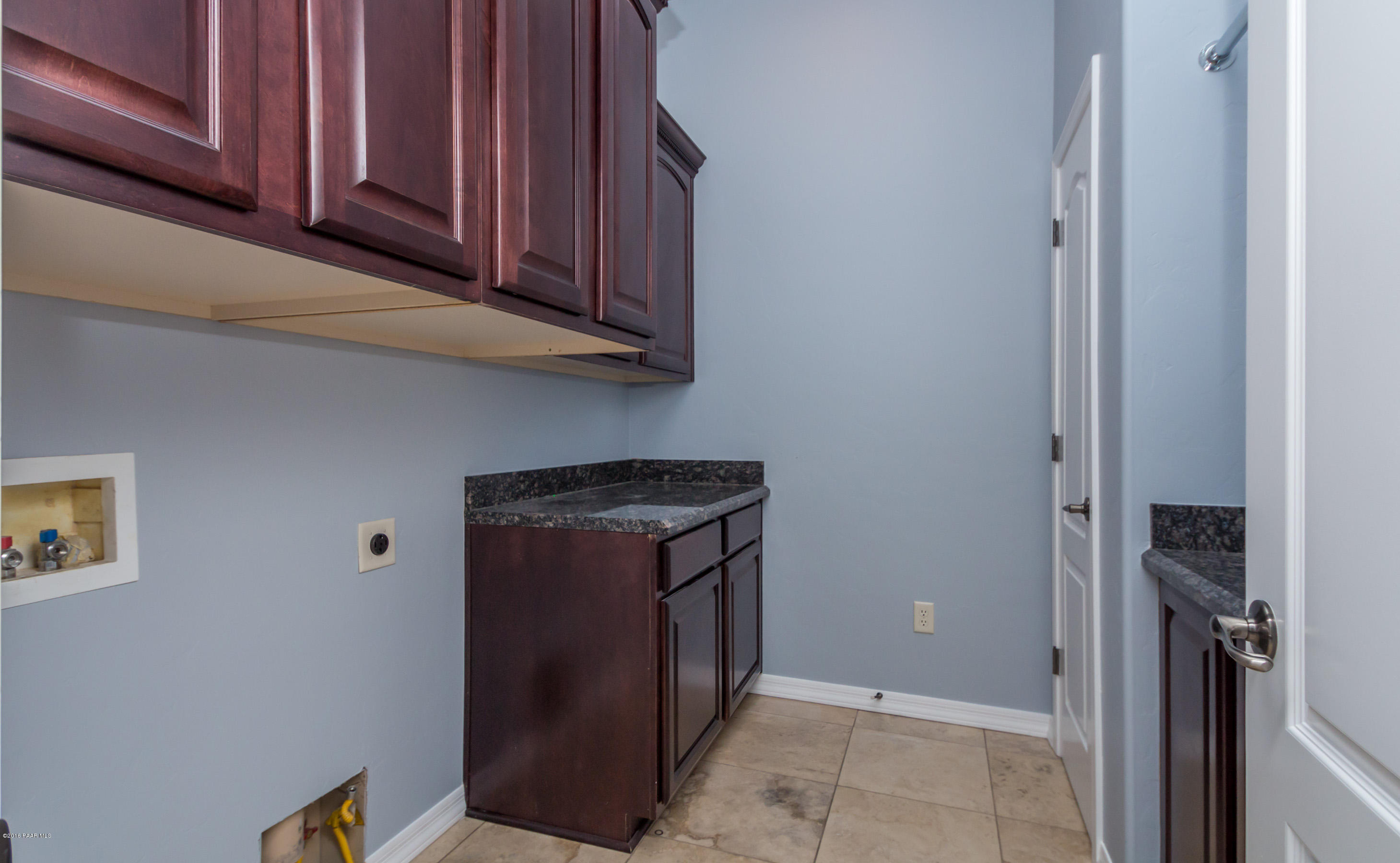 1055 Vantage Point Circle Prescott, AZ 86301 - Photo 17 of 38 a view of a storage and utility room with washer and dryer