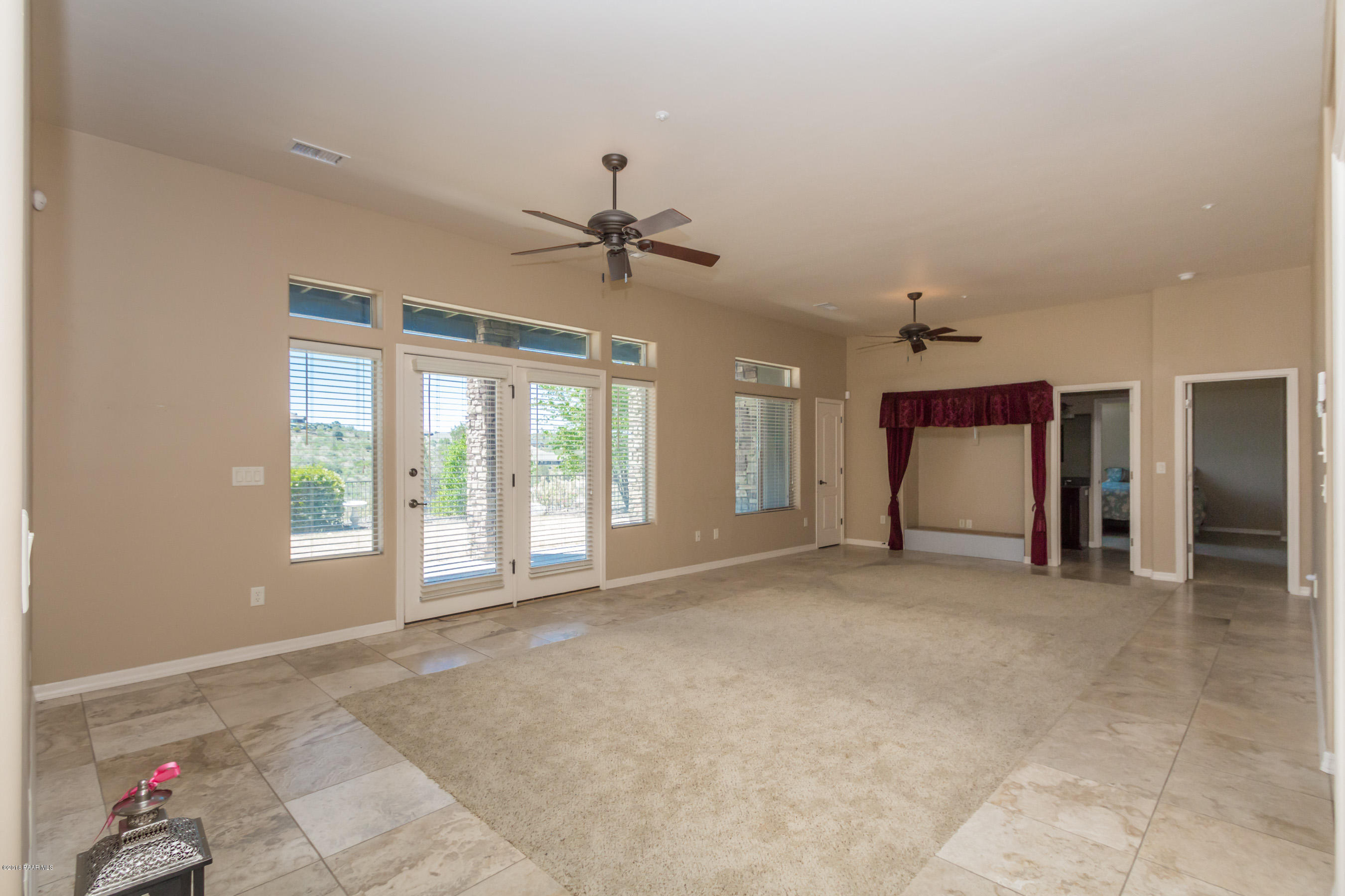 1055 Vantage Point Circle Prescott, AZ 86301 - Photo 18 of 38 a view of an empty room with a fireplace and a window