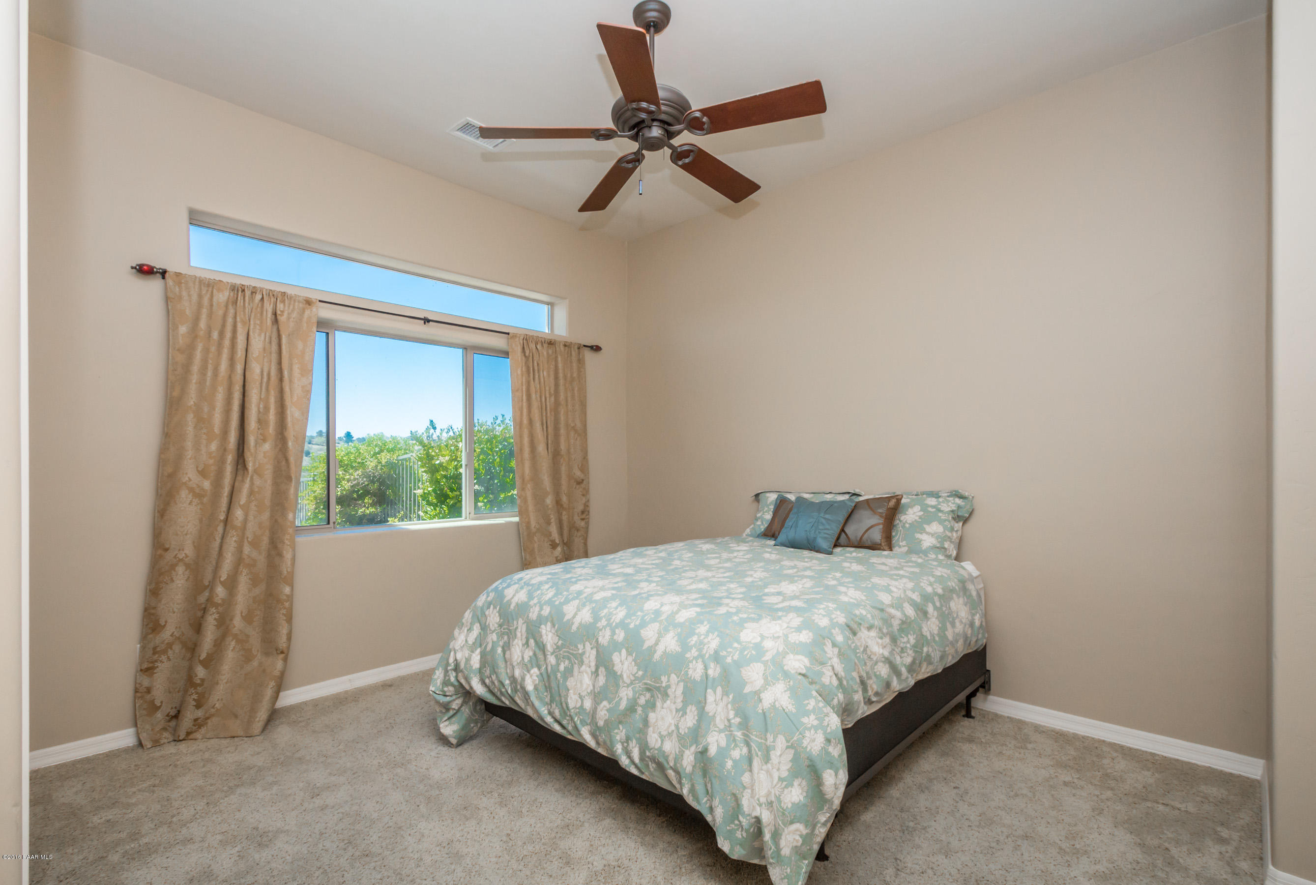1055 Vantage Point Circle Prescott, AZ 86301 - Photo 19 of 38 a bedroom with a bed and a window