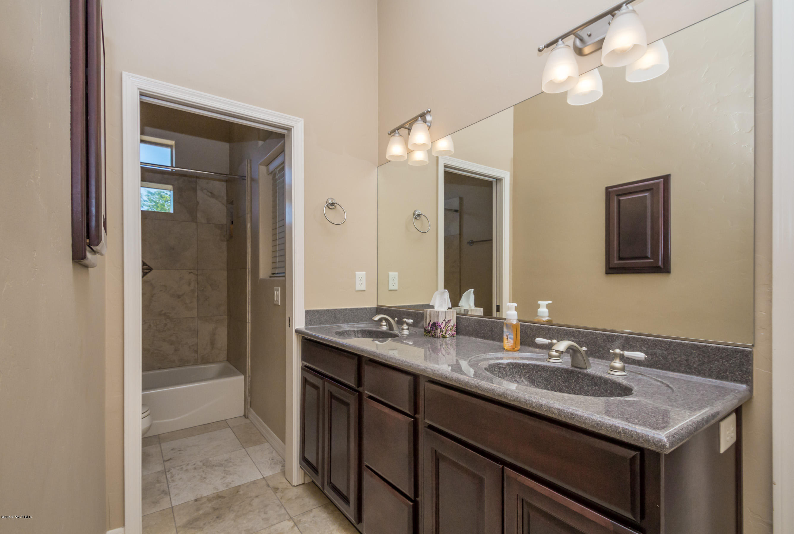 1055 Vantage Point Circle Prescott, AZ 86301 - Photo 20 of 38 a bathroom with a sink double vanity granite and a shower