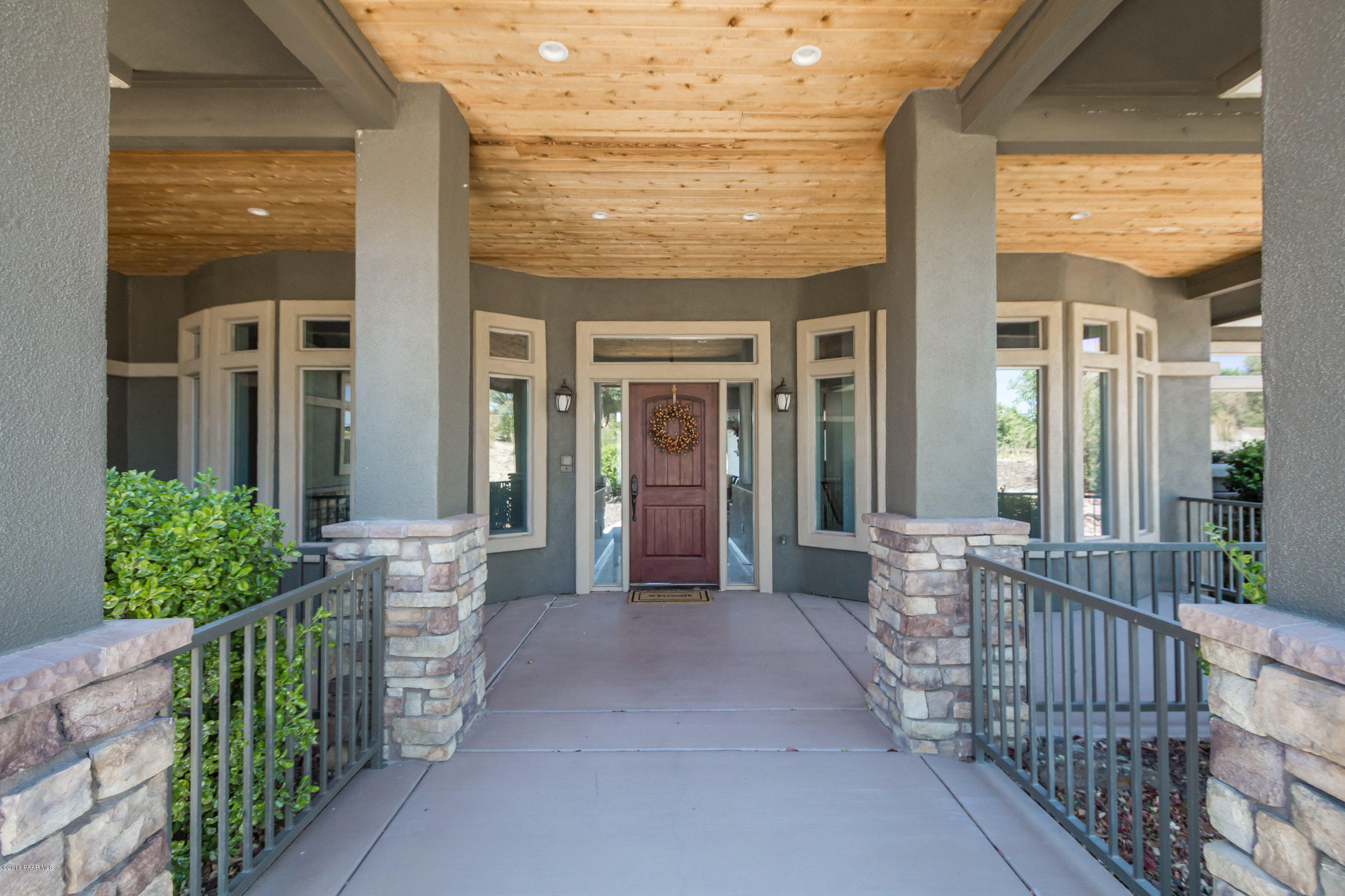 1055 Vantage Point Circle Prescott, AZ 86301 - Photo 2 of 38 a view of a porch with wooden floor and stairs