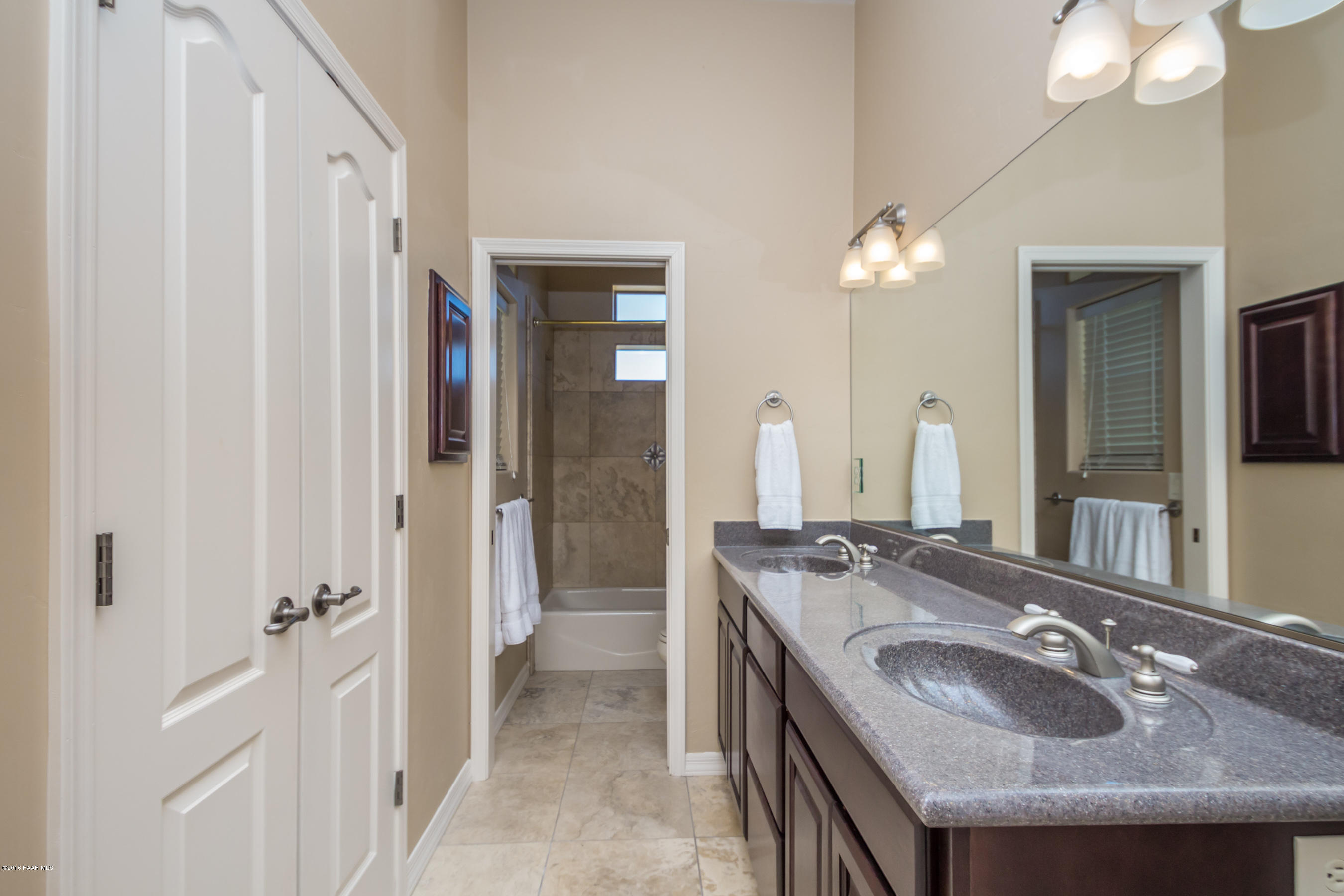 1055 Vantage Point Circle Prescott, AZ 86301 - Photo 22 of 38 a bathroom with sinks granite countertop a sink and a mirror