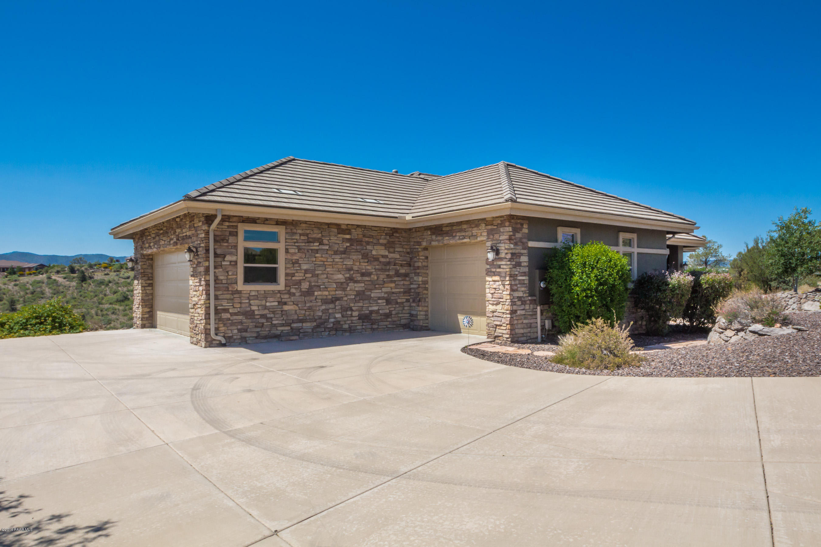 1055 Vantage Point Circle Prescott, AZ 86301 - Photo 27 of 38 a front view of a house with garden