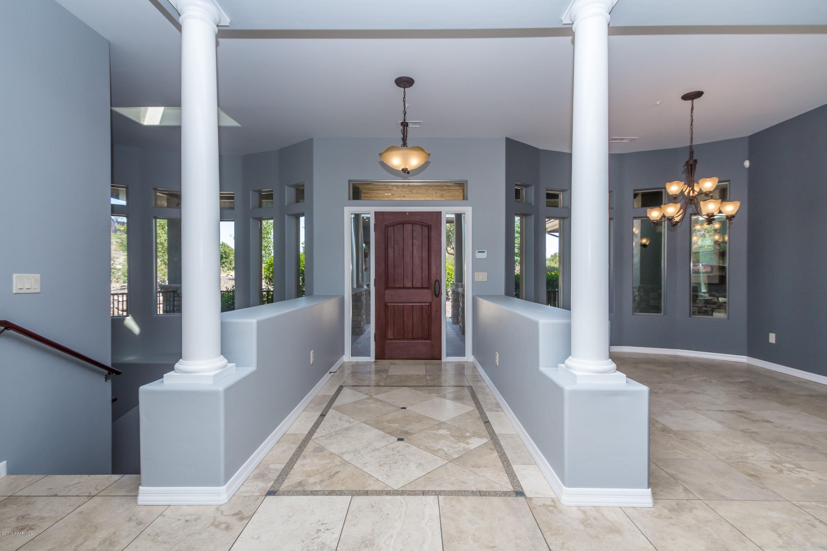 1055 Vantage Point Circle Prescott, AZ 86301 - Photo 3 of 38 a view of an entryway with dining area chandelier and glass door