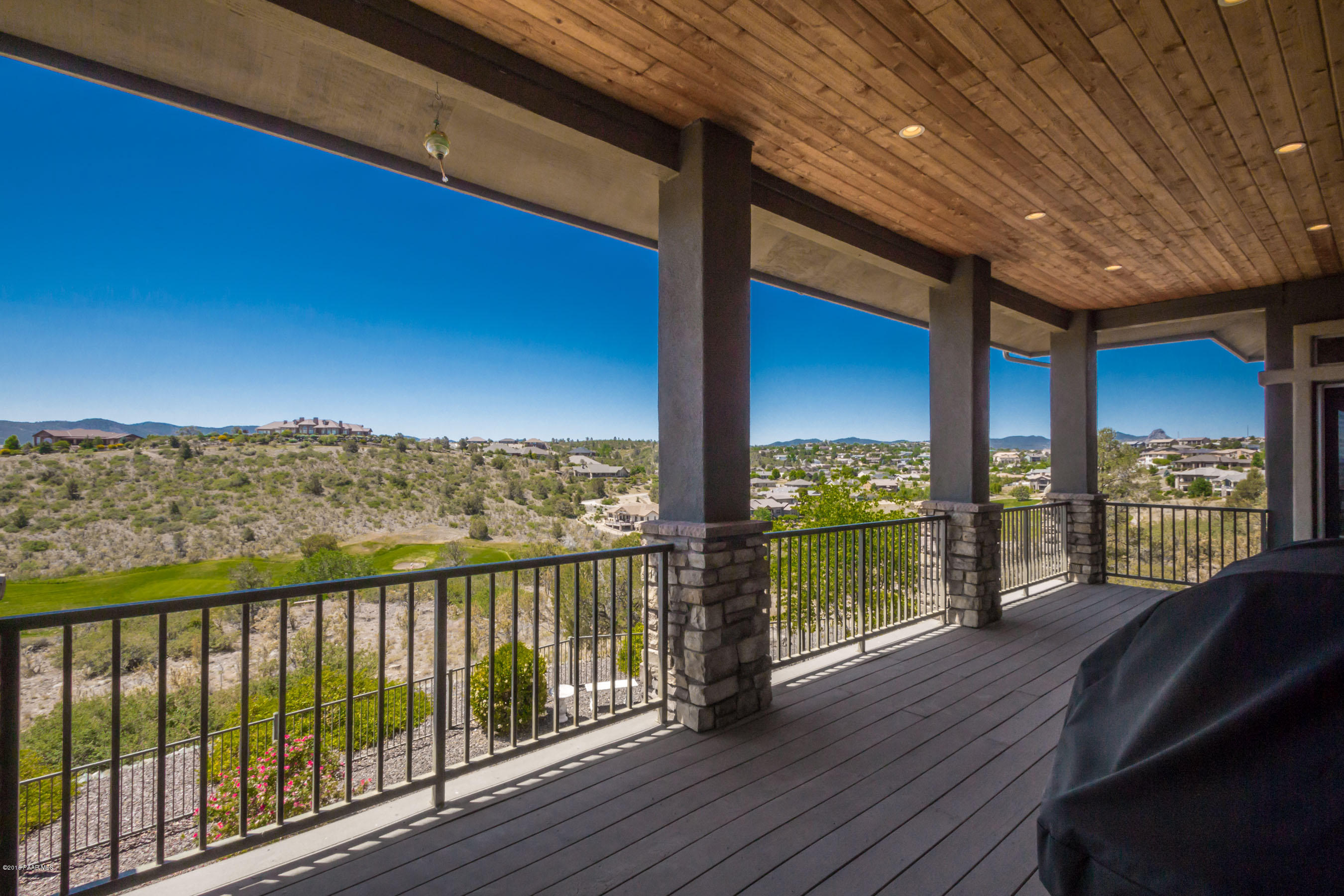 1055 Vantage Point Circle Prescott, AZ 86301 - Photo 32 of 38 a view of a balcony with chair and wooden floor