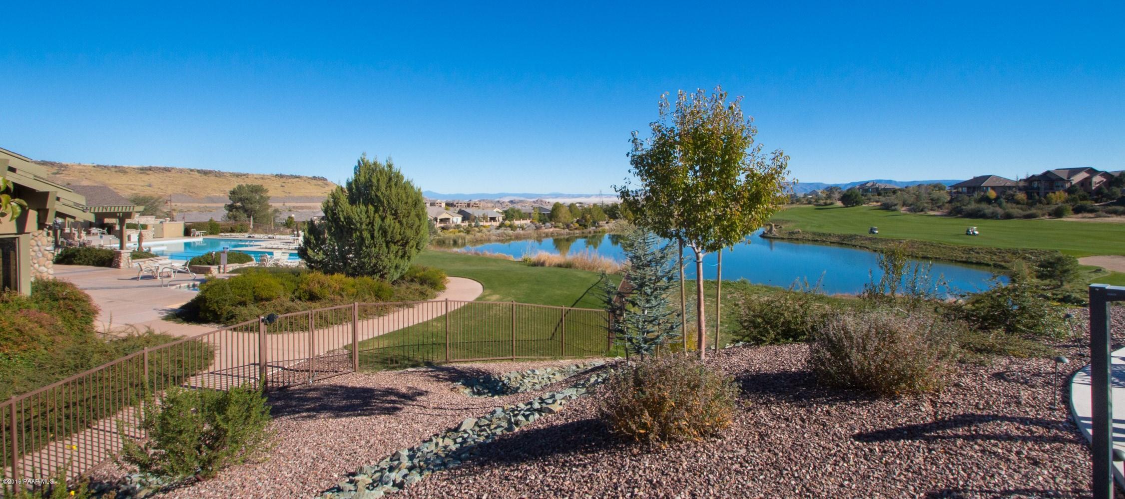 1055 Vantage Point Circle Prescott, AZ 86301 - Photo 38 of 38 a view of a lake with a building in the background