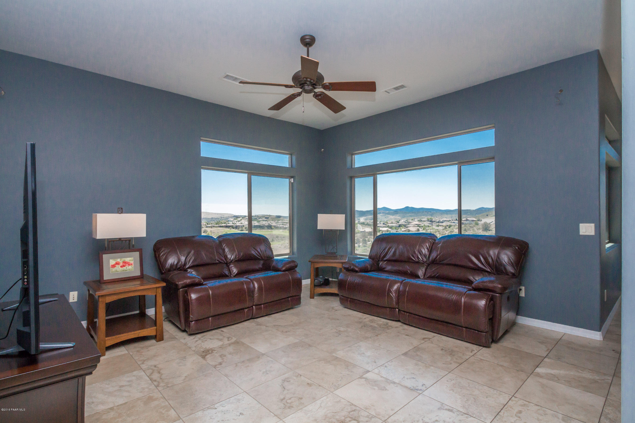 1055 Vantage Point Circle Prescott, AZ 86301 - Photo 5 of 38 a living room with furniture a ceiling fan and a window