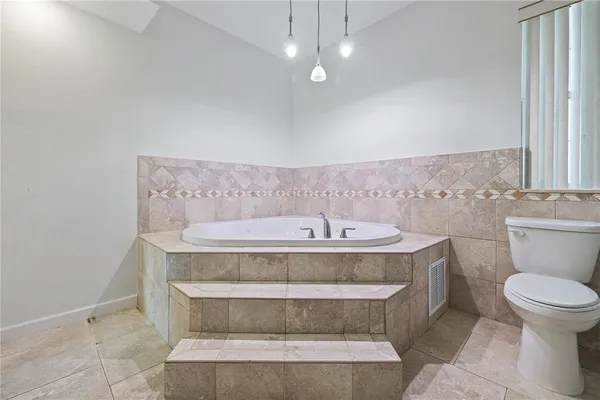 a view of bathroom with toilet and a view