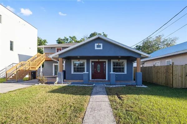 front view of a house with a yard