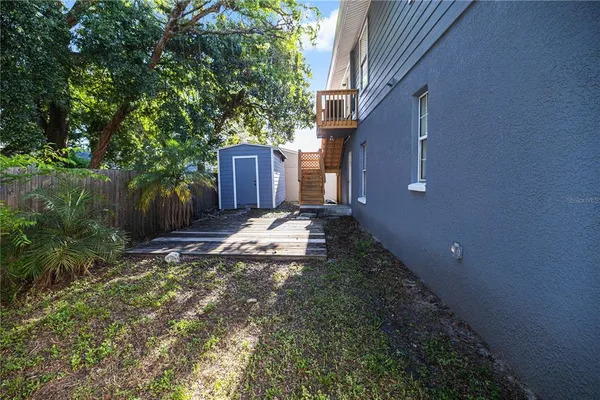 a view of a back yard of the house