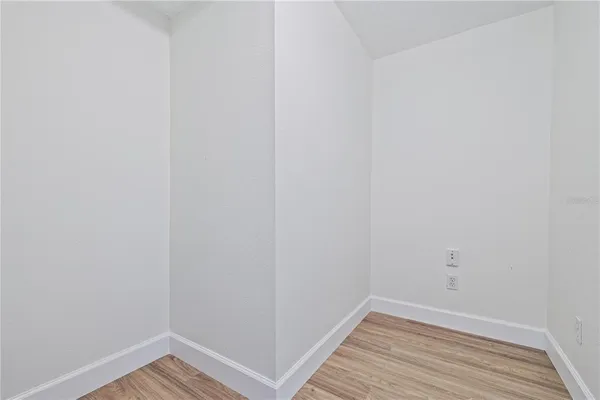 a view of a small space with wooden floor