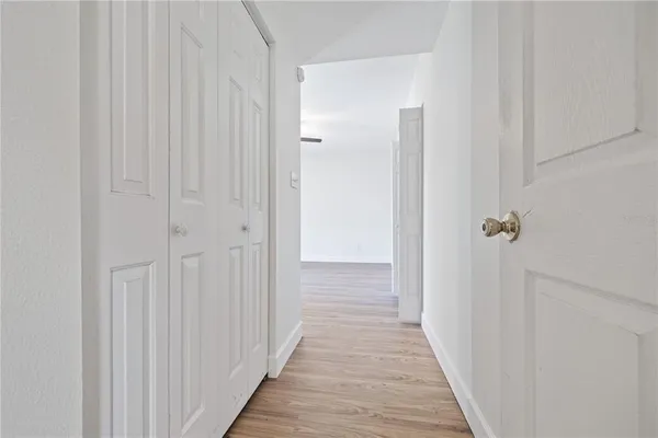 a view of a bathroom from the hallway