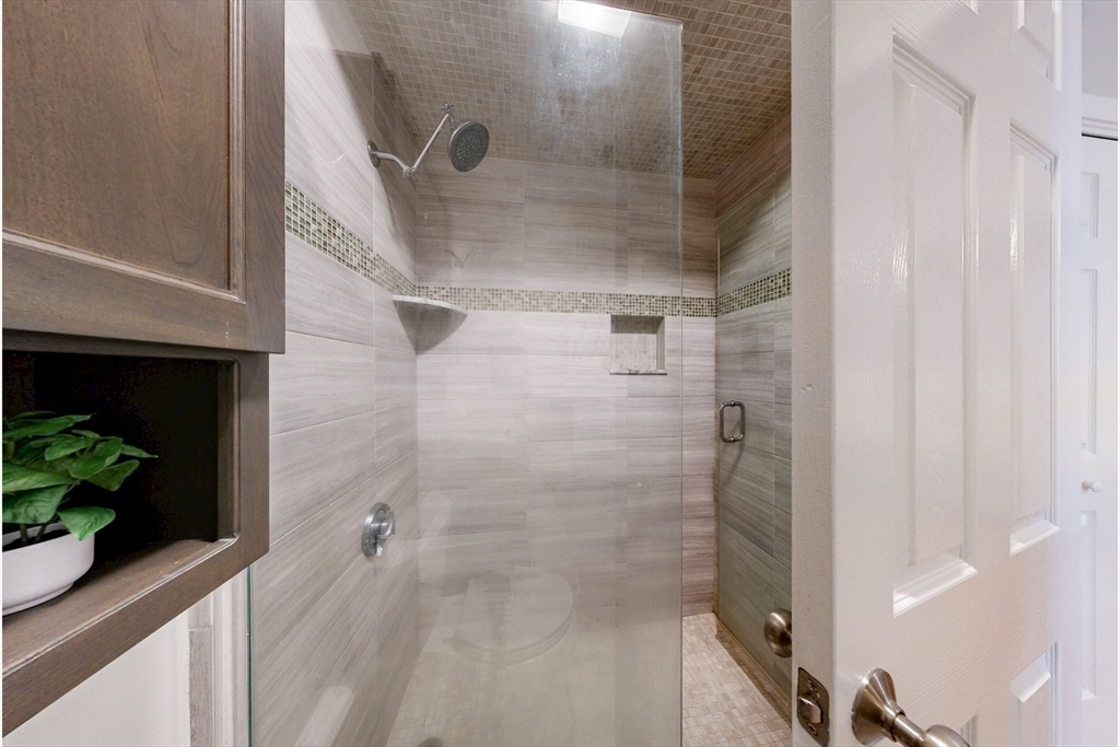 111 West 8th Street, Unit C Boston, MA 02127 - Photo 14 of 22 a bathroom with a shower
