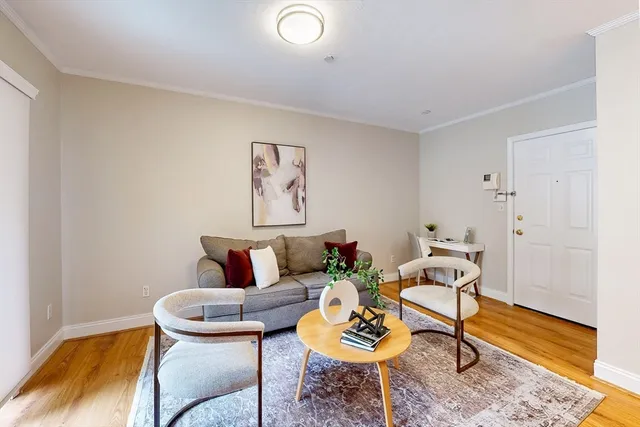 a bedroom with a bed and a chair