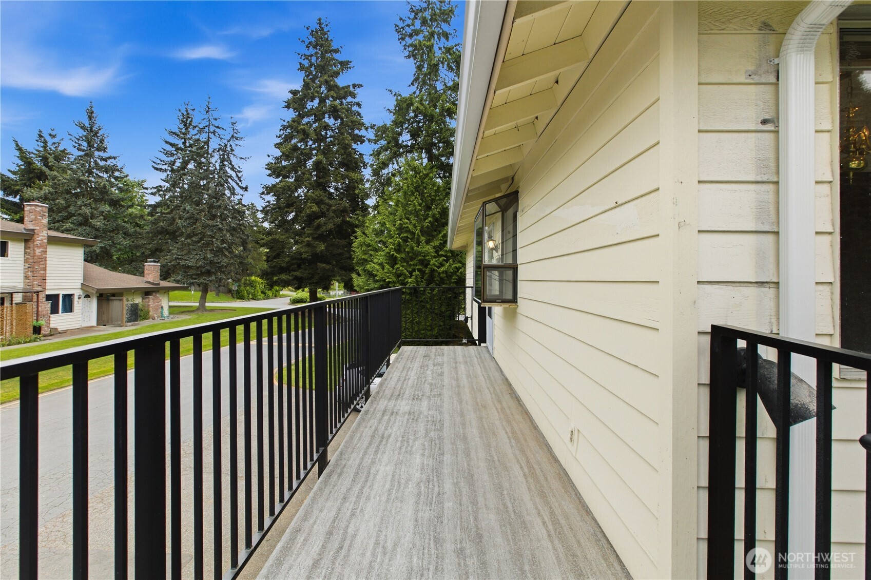 412 213th Place Southwest, Unit 21D Bothell, WA 98021 - Photo 3 of 28 a view of a balcony with wooden floor and fence