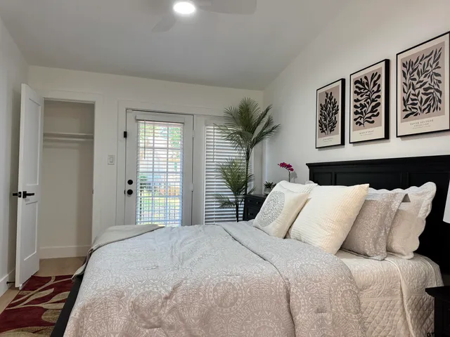 a bedroom with a bed and a dresser