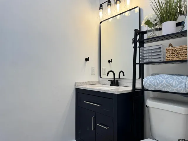 a bathroom with a glass shower door
