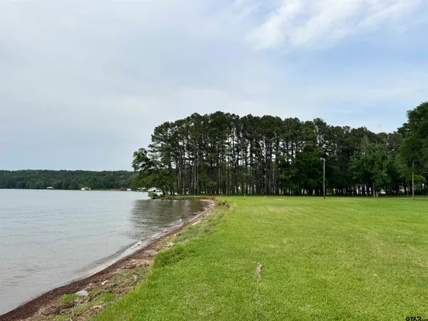 a view of a lake with a big yard