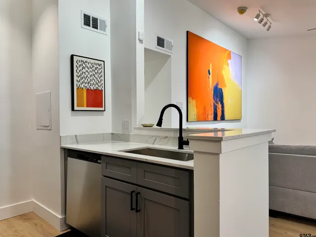 a kitchen with a stove and a microwave