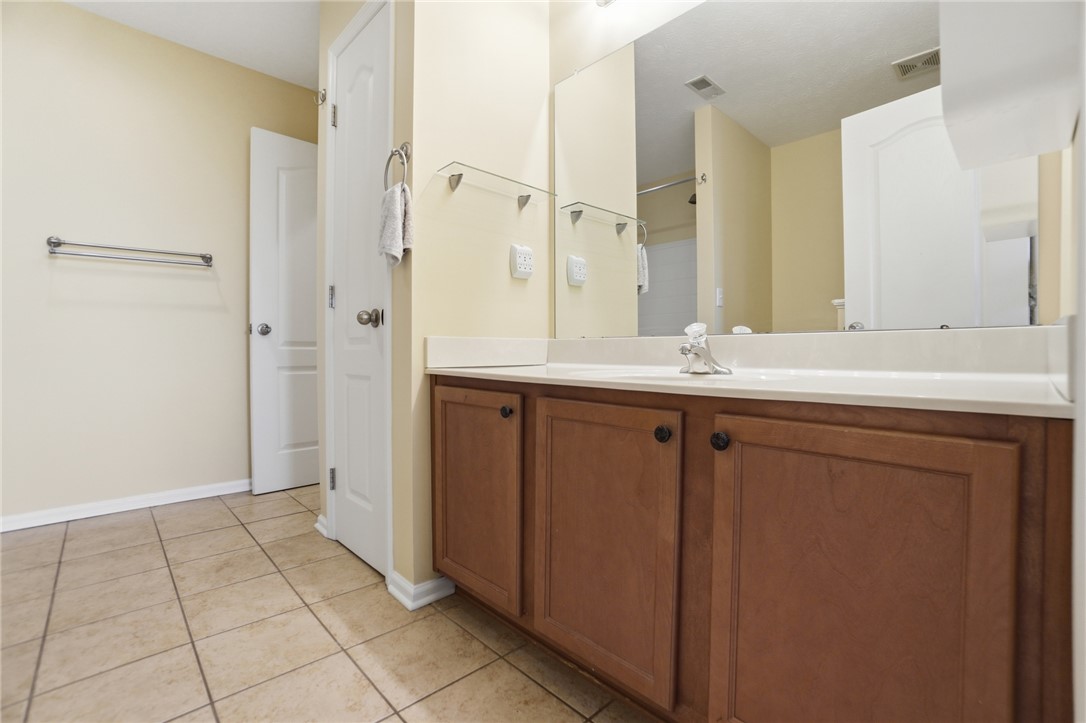 4324 Straight Arrow Road Dayton, OH 45430 - Photo 23 of 40 Bright and airy, this bathroom offers a functional vanity with ample storage.