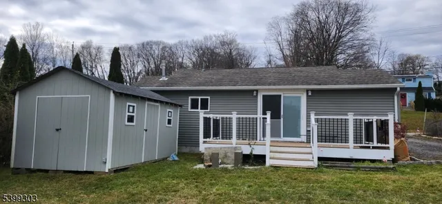 a view of a house with a yard