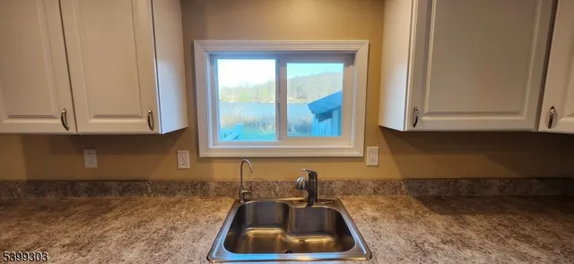 a kitchen with a sink and cabinets