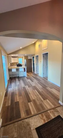 a room with wooden floor and furniture