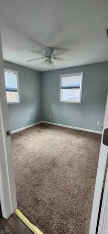 en empty room with windows