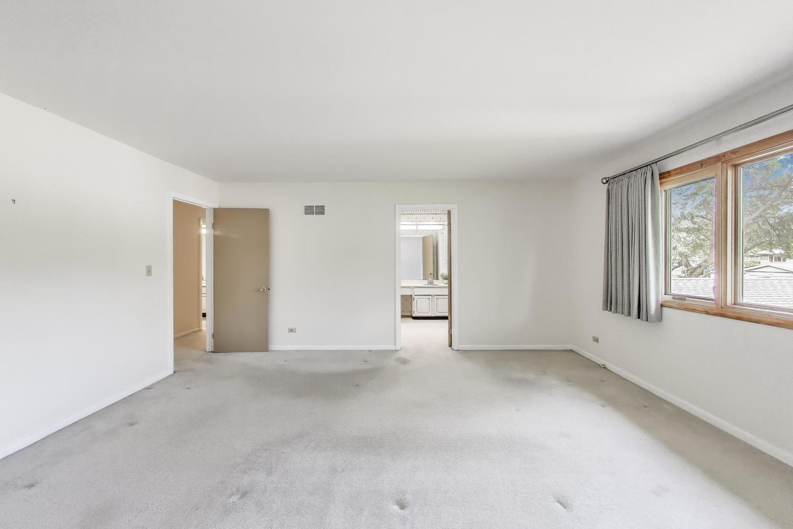 1904 Birch Road Northbrook, IL 60062 - Photo 15 of 37 a view of an empty room with a window