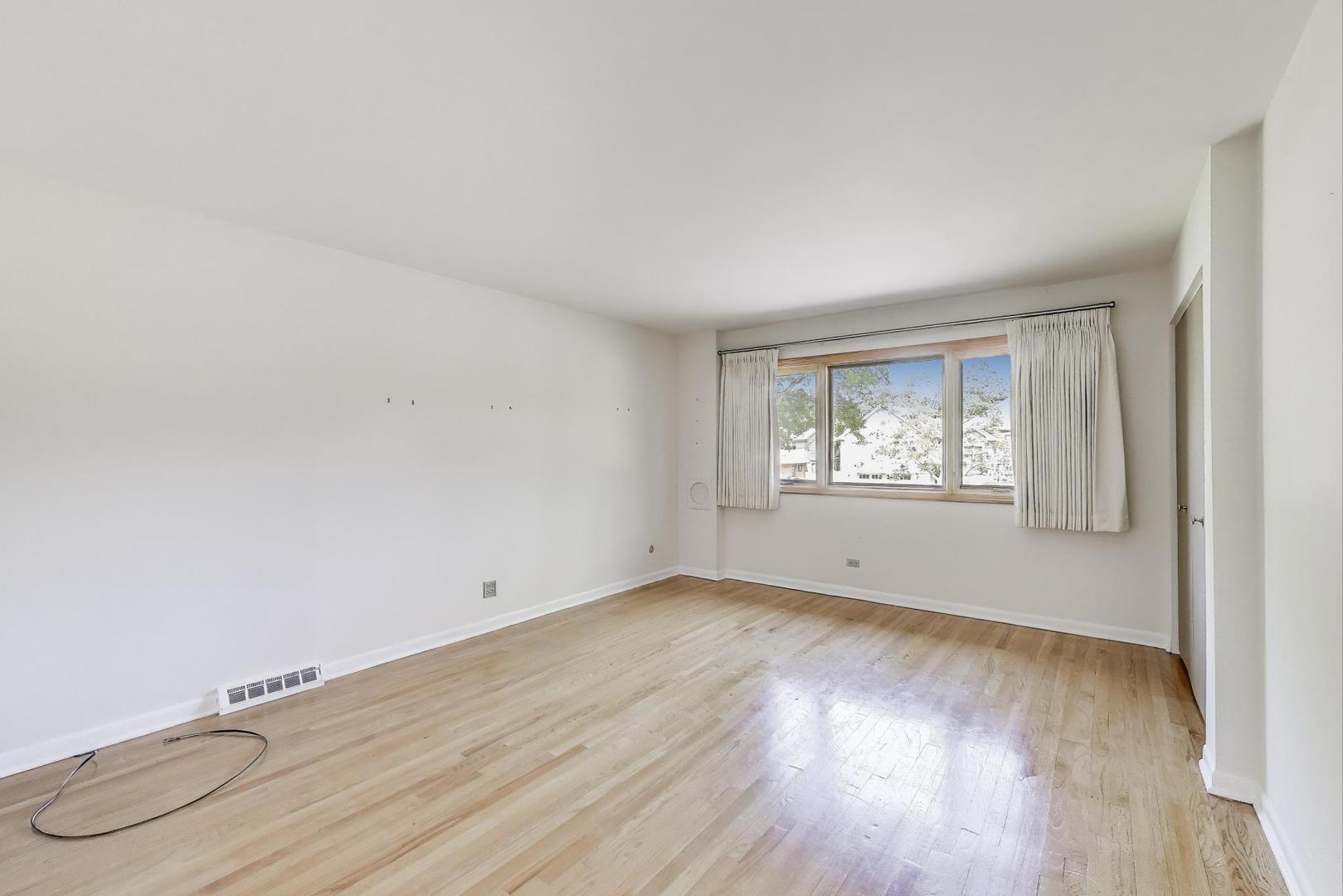1904 Birch Road Northbrook, IL 60062 - Photo 19 of 37 an empty room with wooden floor and windows