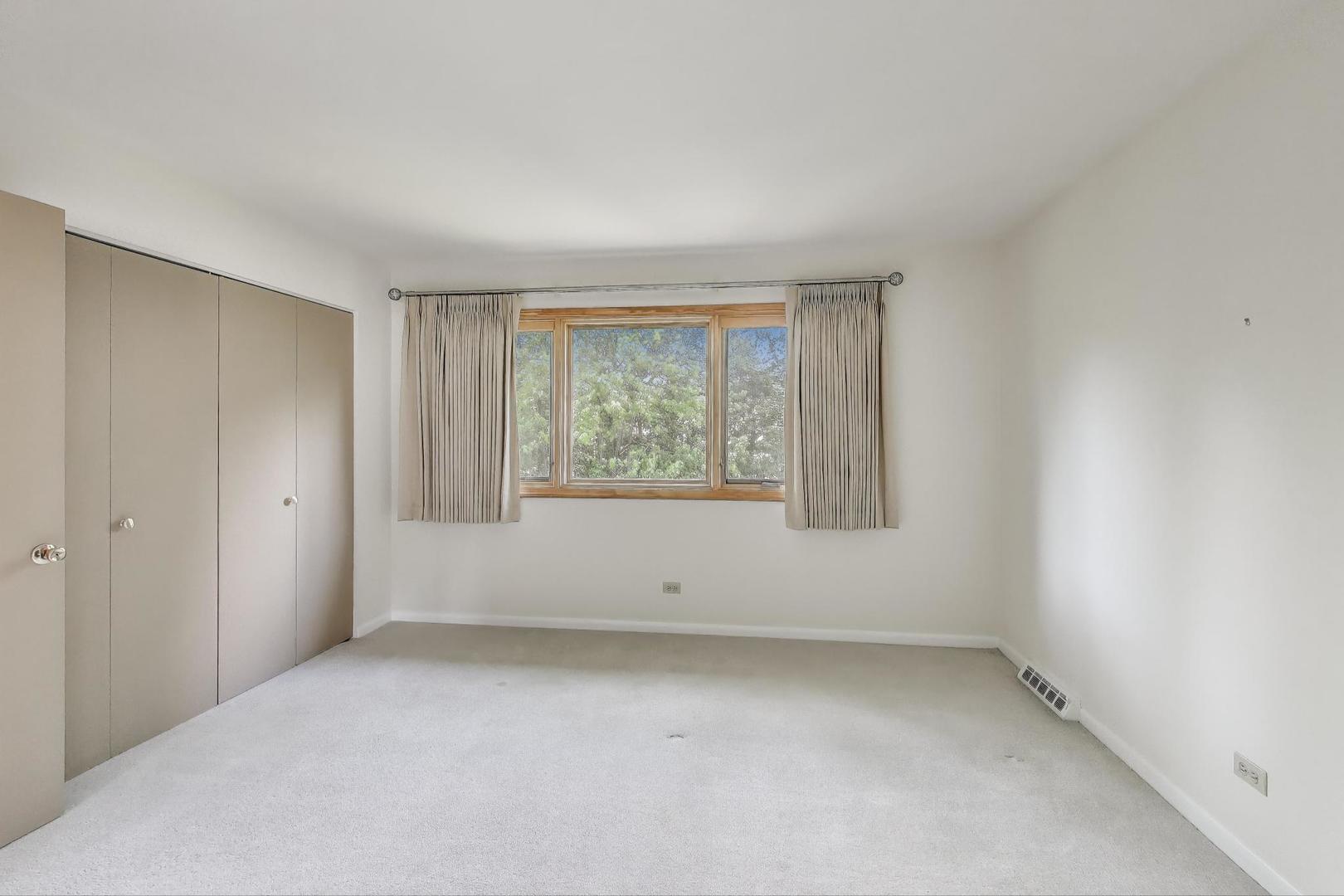 1904 Birch Road Northbrook, IL 60062 - Photo 20 of 37 an empty room with a window