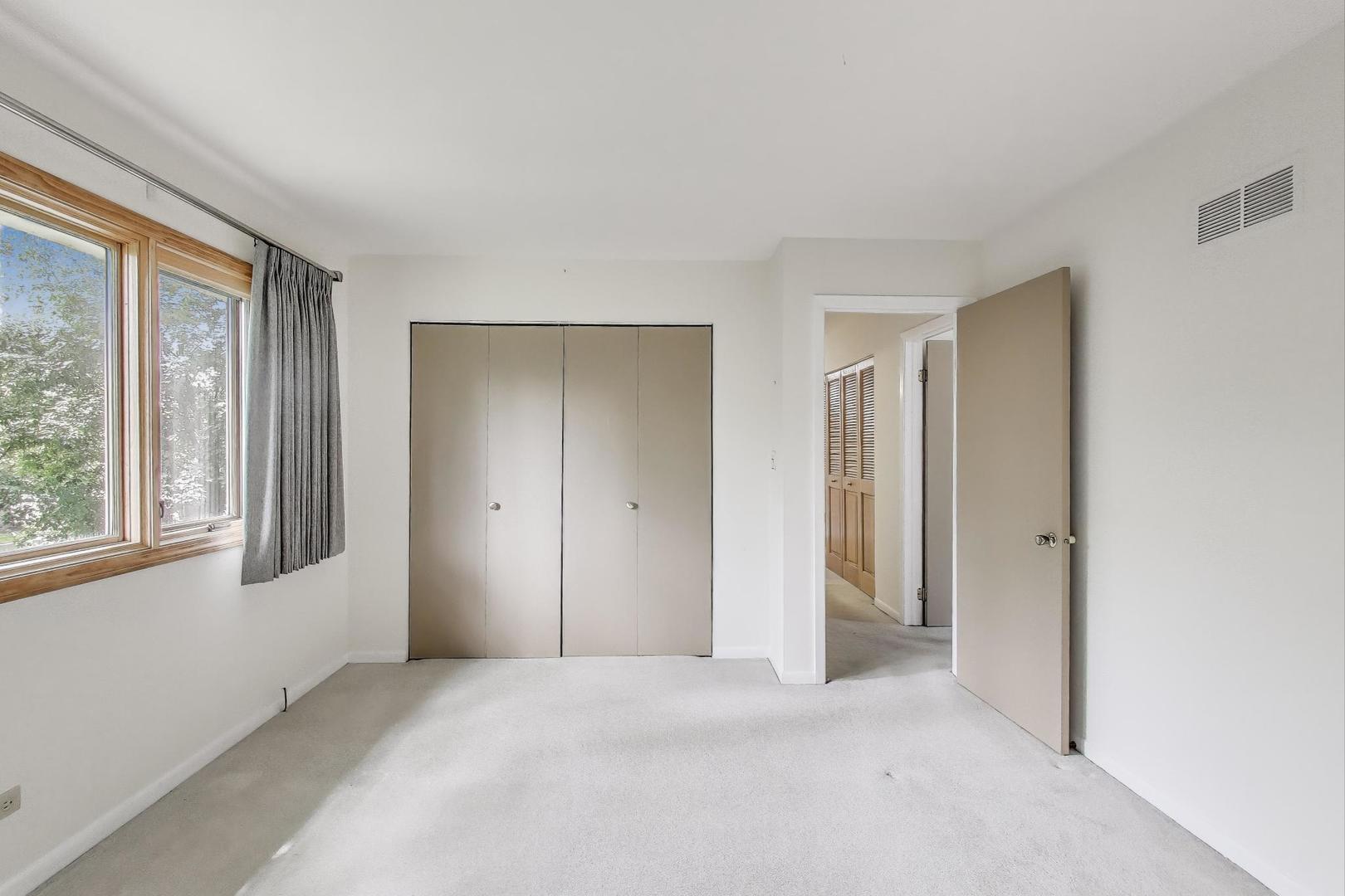 1904 Birch Road Northbrook, IL 60062 - Photo 22 of 37 a view of an empty room with a window