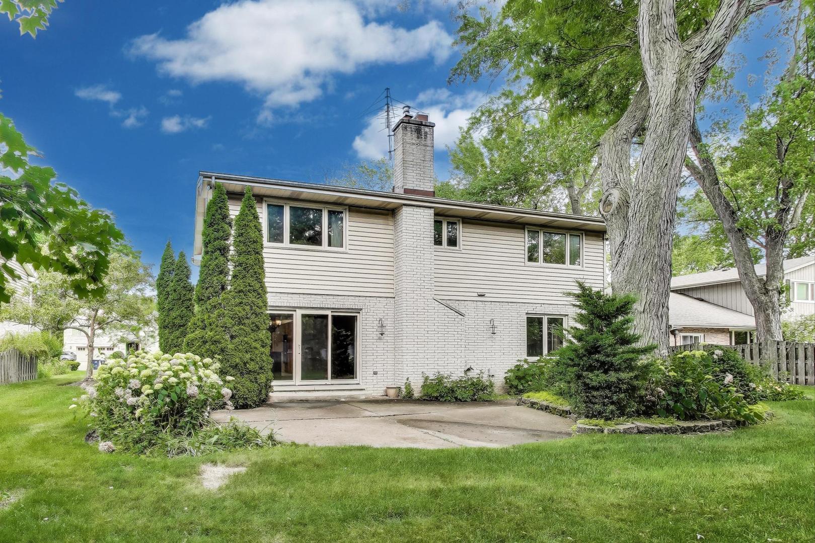 1904 Birch Road Northbrook, IL 60062 - Photo 28 of 37 a front view of a house with a yard and garage