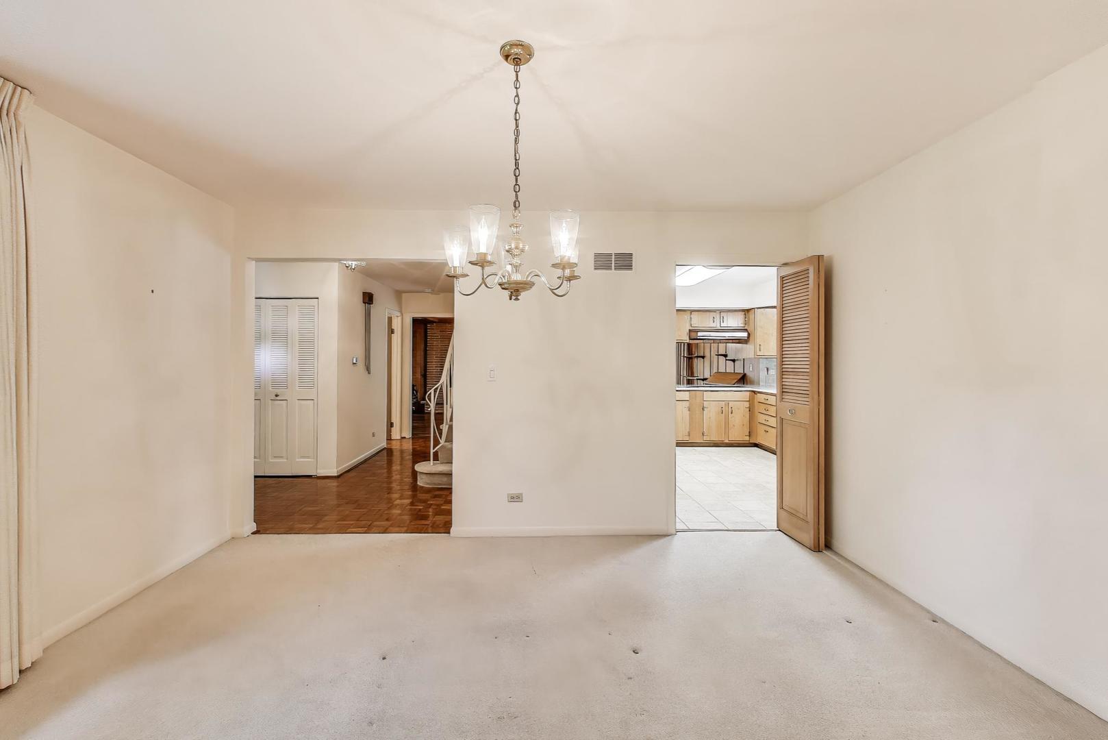 1904 Birch Road Northbrook, IL 60062 - Photo 5 of 37 a view of a kitchen with a refrigerator and chandelier