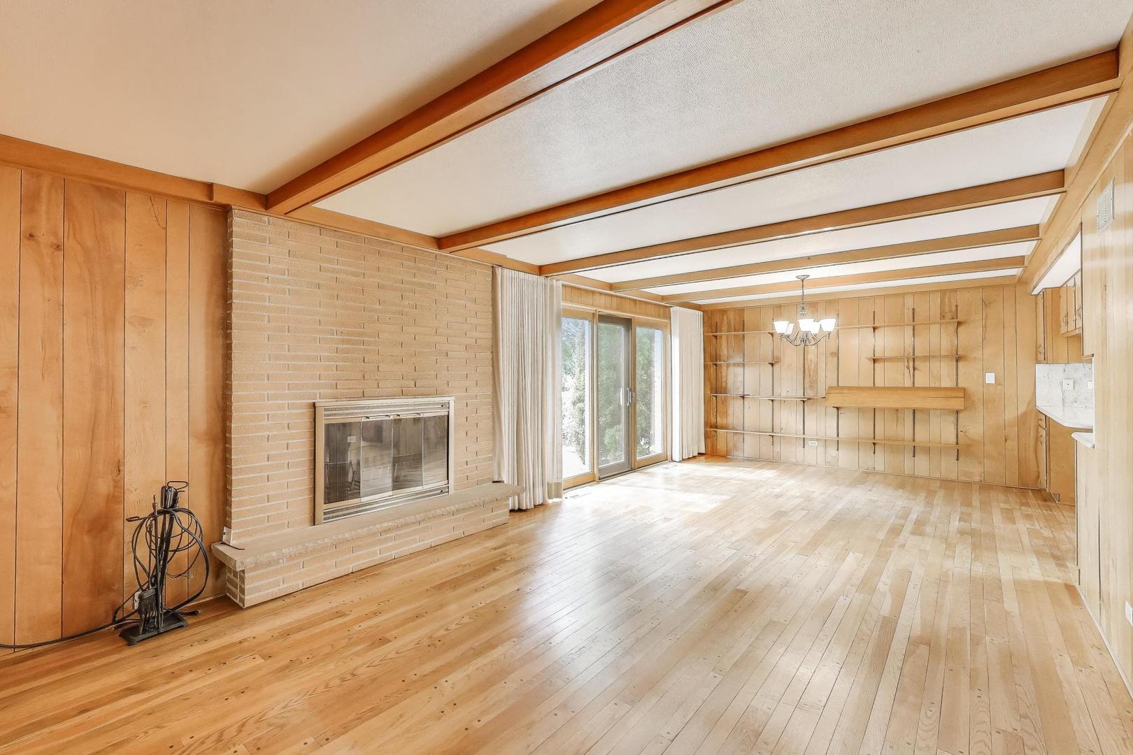 1904 Birch Road Northbrook, IL 60062 - Photo 9 of 37 a big room with wooden floor and fireplace