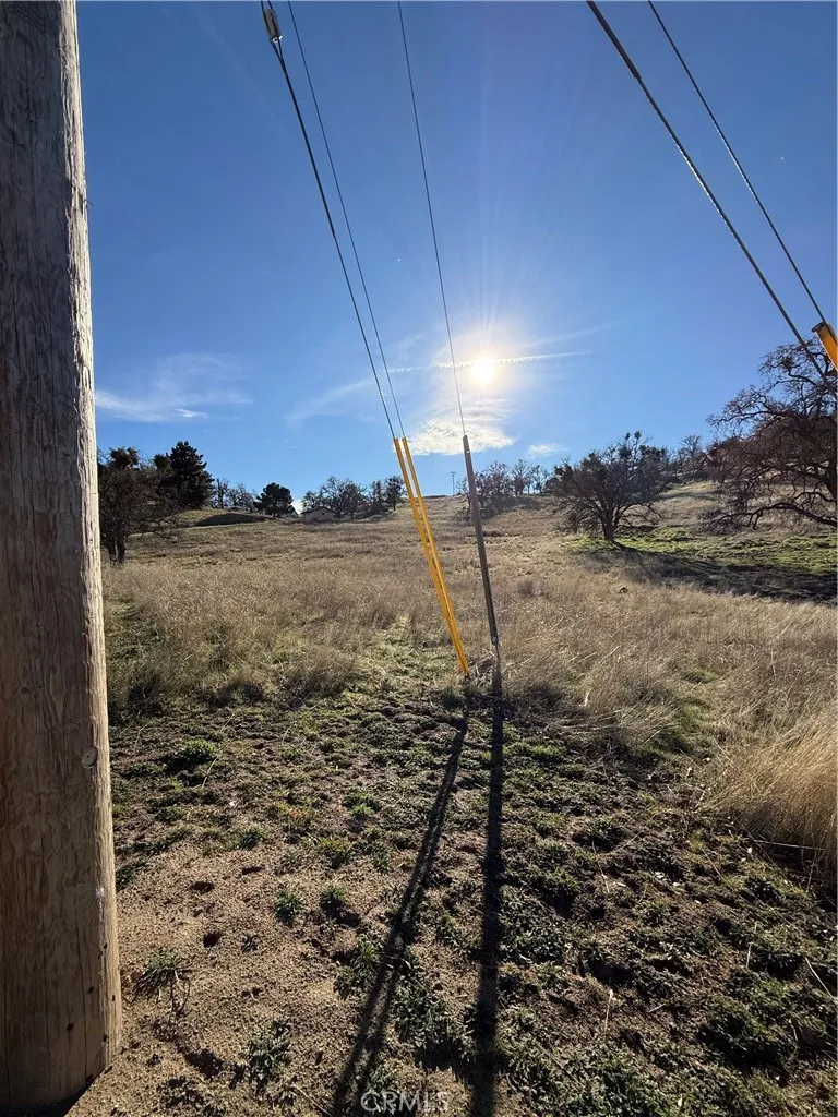 0 Stallion Springs Drive Tehachapi, CA 93561 - Photo 3 of 4 a view of a dry yard with wooden fence