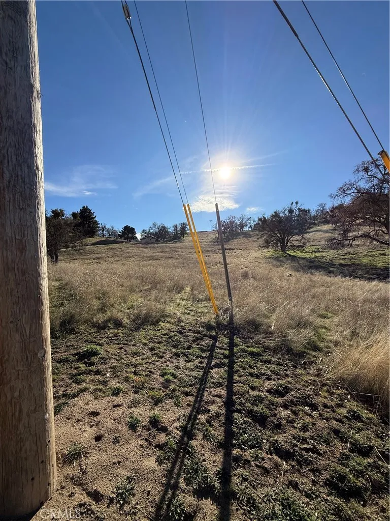 0 Stallion Springs Drive Tehachapi, CA 93561 - Photo 3 of 4 a view of a dry yard with wooden fence