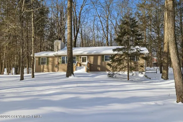 a house with trees in the background