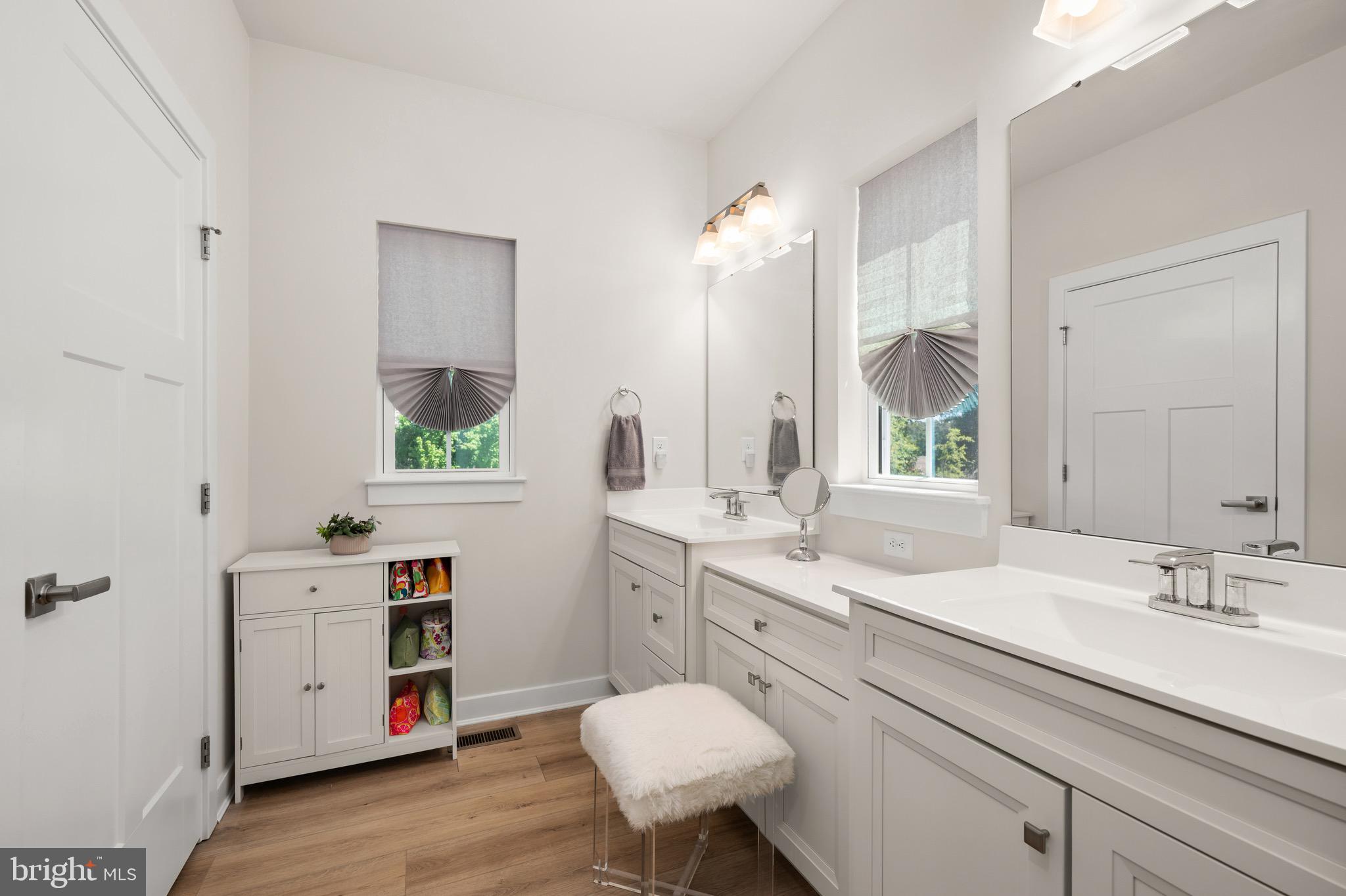 30478 Indigo Way Georgetown, DE 19947 - Photo 15 of 41 a spacious bathroom with a sink double vanity and a mirror