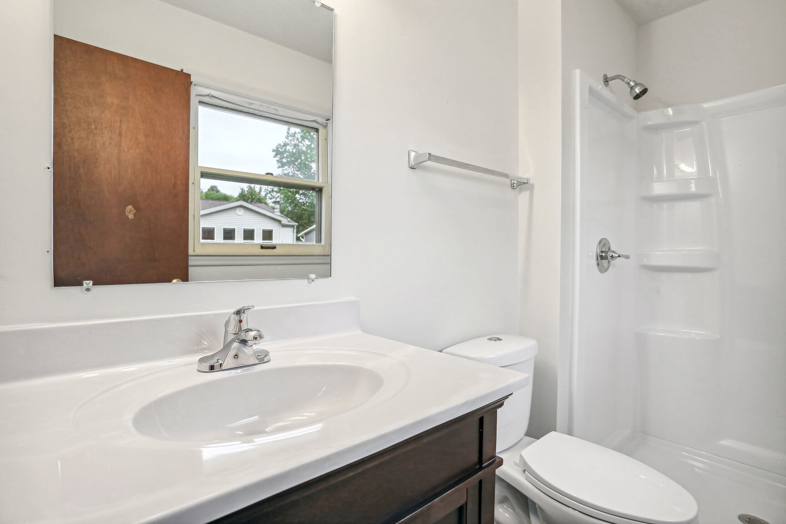 2307 Aspen Drive Champaign, IL 61821 - Photo 23 of 26 a bathroom with a sink toilet and shower