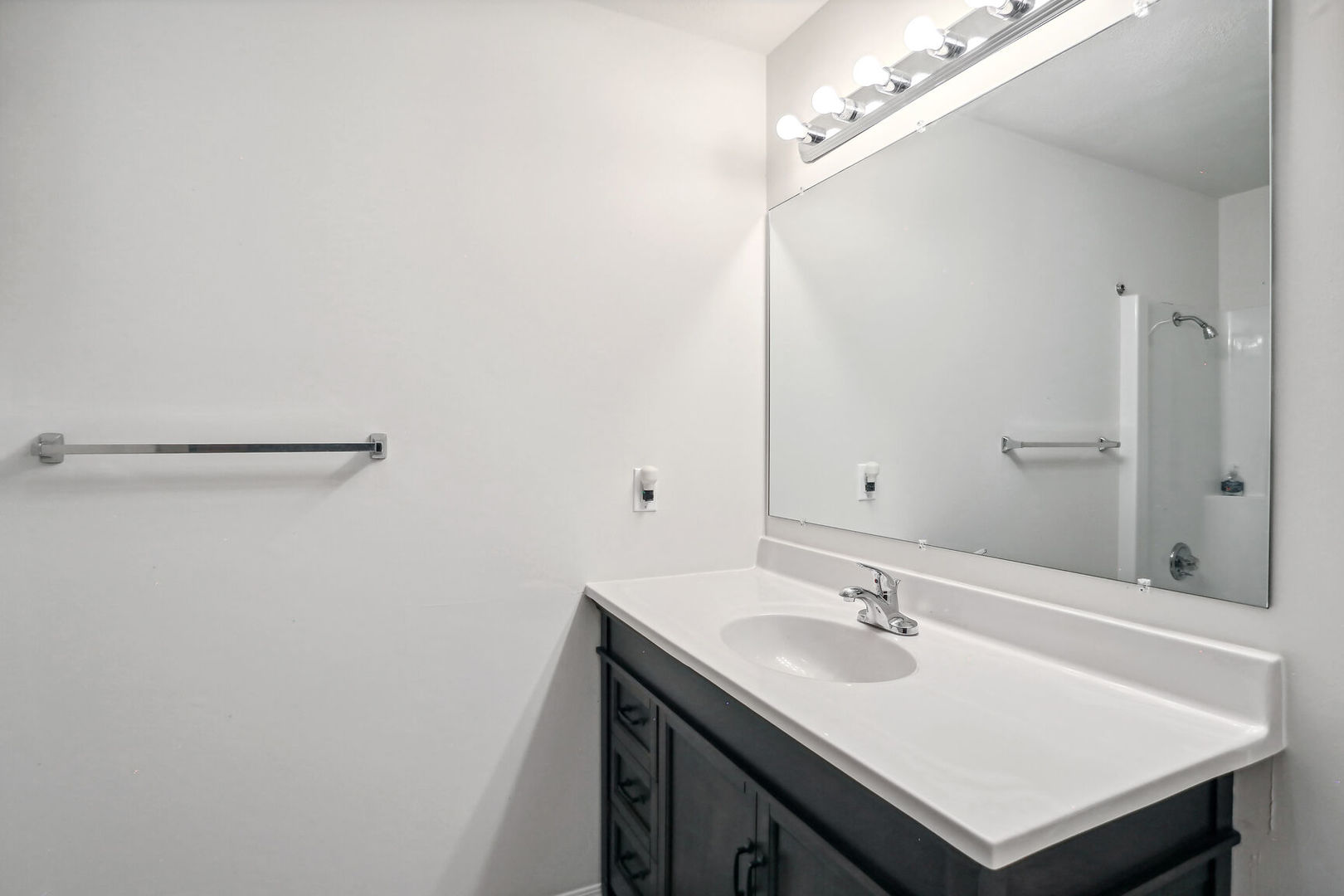 2307 Aspen Drive Champaign, IL 61821 - Photo 24 of 26 a bathroom with a sink a mirror and a shower