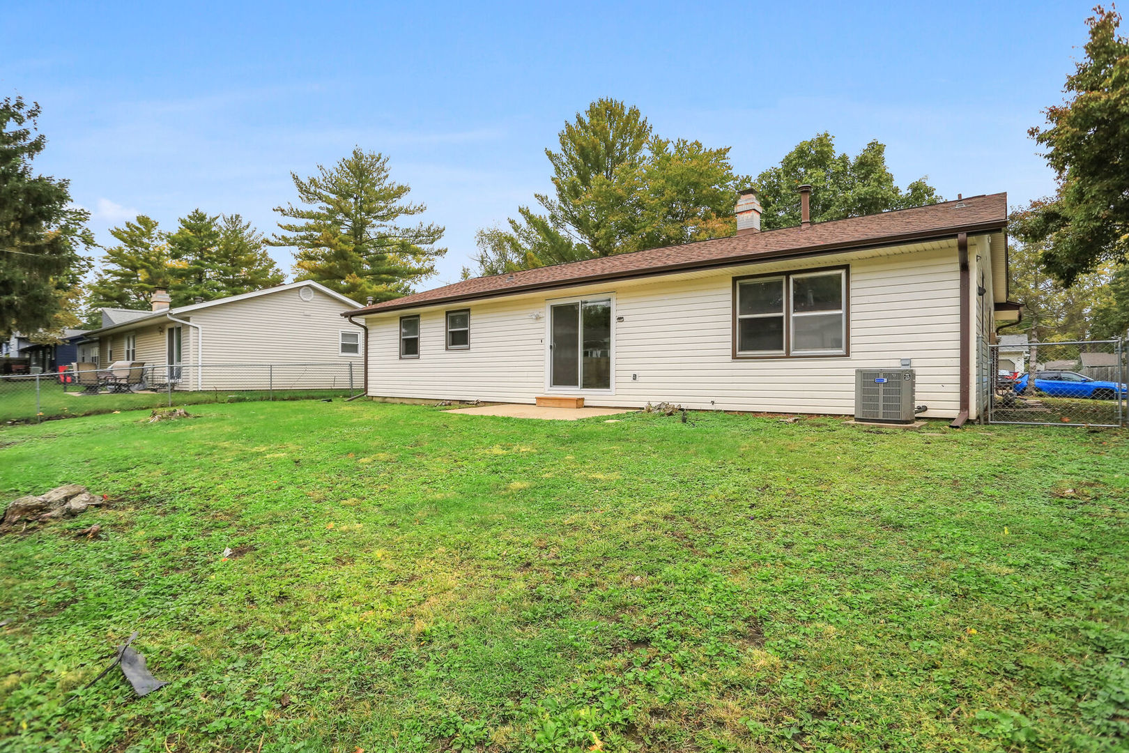 2307 Aspen Drive Champaign, IL 61821 - Photo 6 of 26 a view of a house with a yard