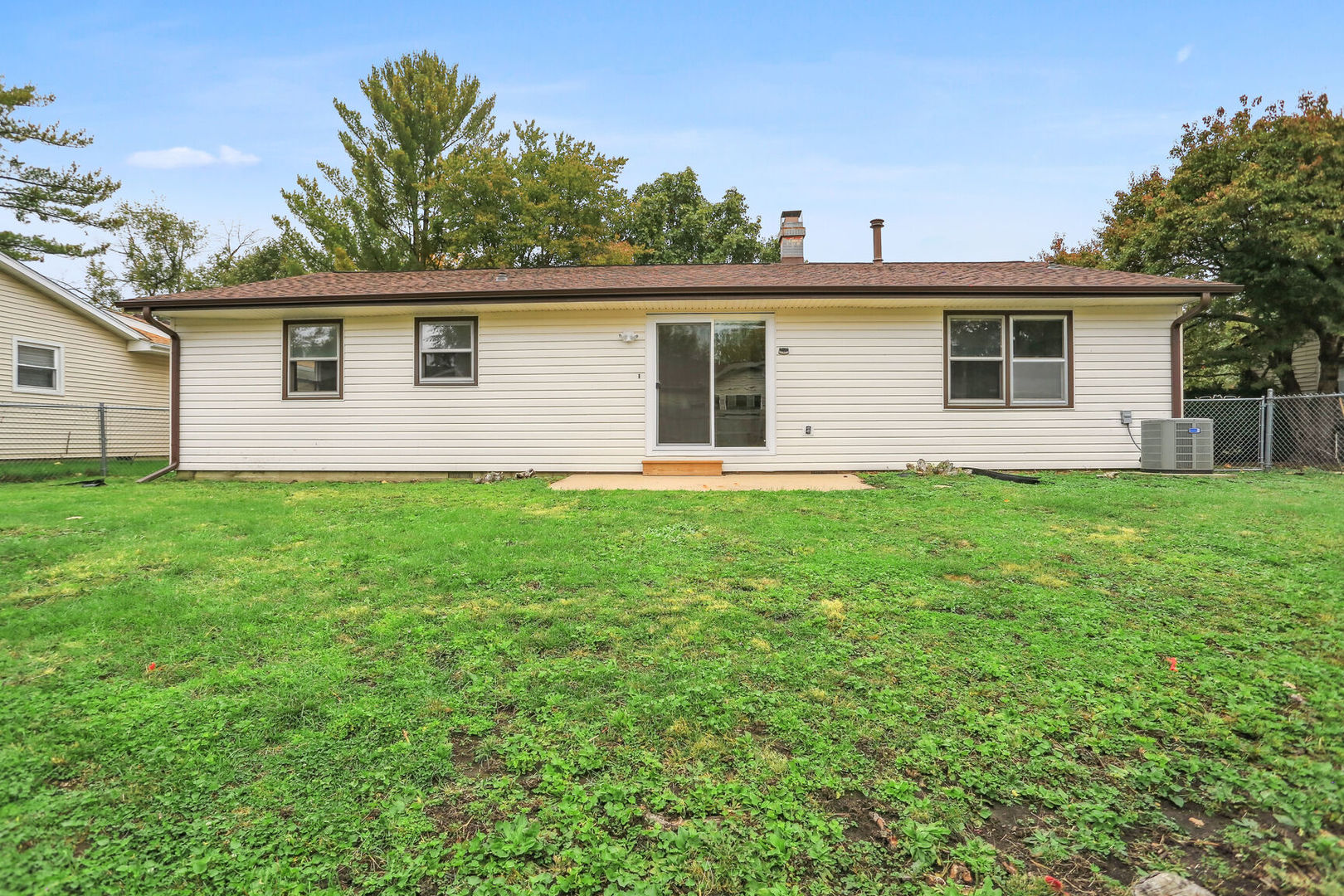 2307 Aspen Drive Champaign, IL 61821 - Photo 7 of 26 a view of a house with a yard
